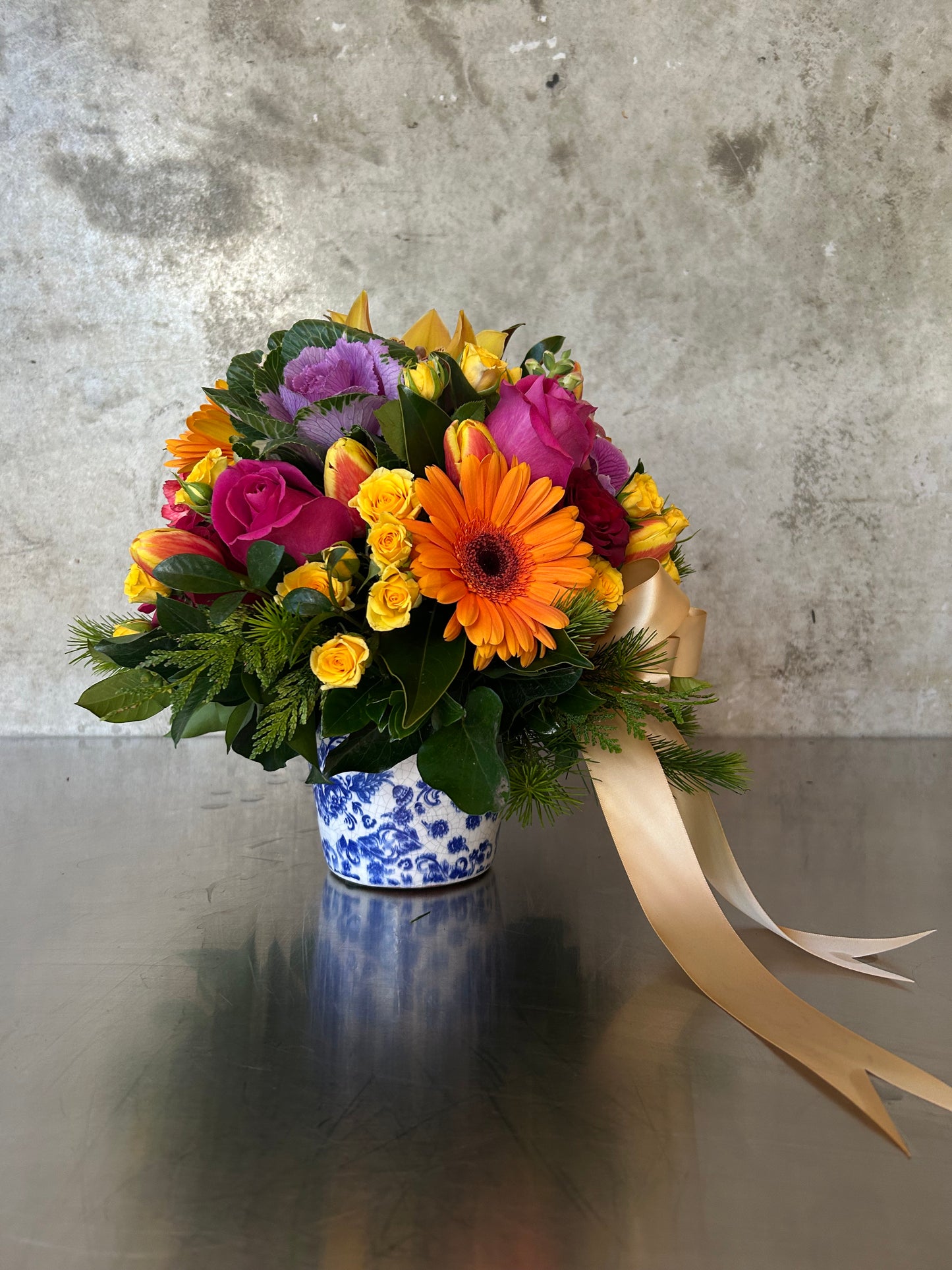 Cairo arrangement from James St Florist in a designer vessel. Vessel may vary depending on available stock.